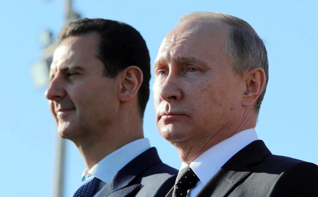 Башар Асад и Владимир Путин на авиабазе Хмеймим в Сирии, декабрь 2017 года. Фото: Reuters