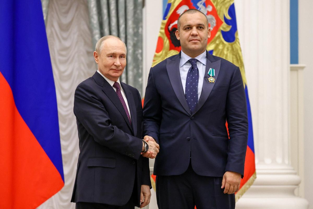 Путин и Умар Кремлев. Фото: Артем Геодакян / ТАСС