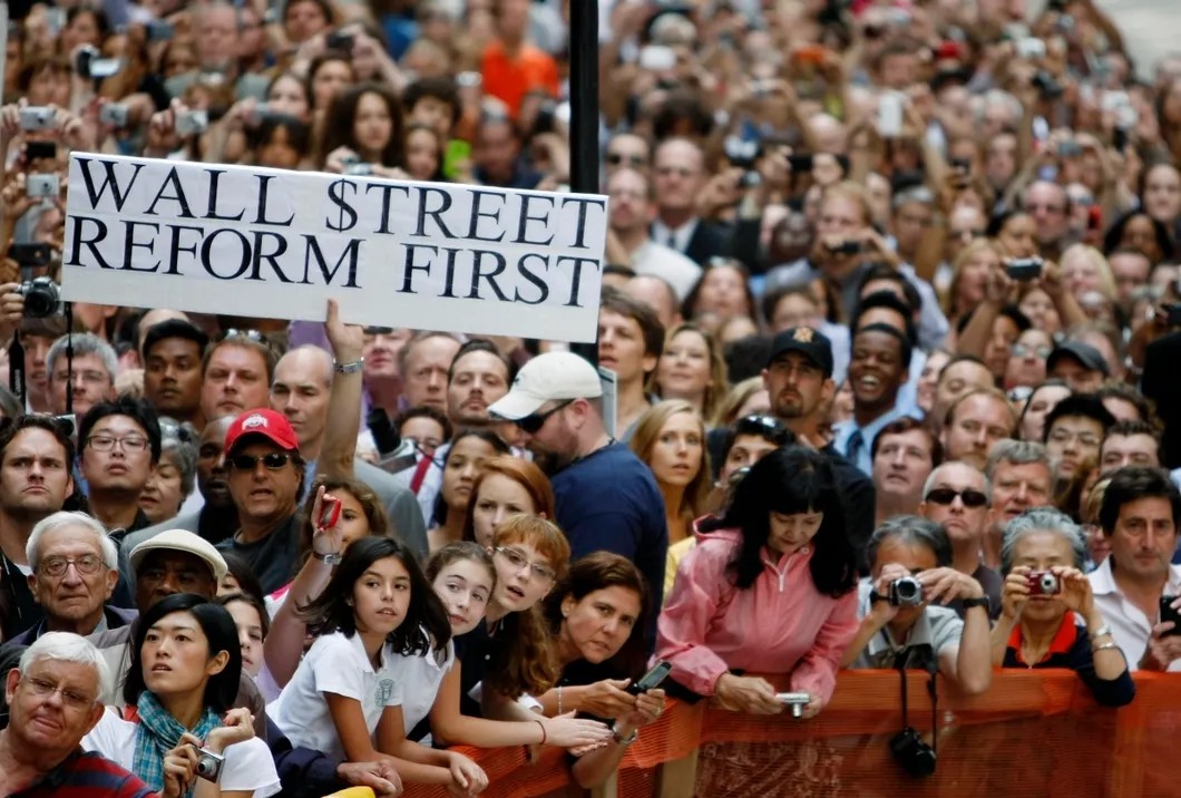 Митинг с требованием срочных реформ на Уолл-Стрит перед выступлением Барака Обамы. Фото: Reuters