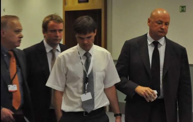 Юрист Андрей Павлов (на заднем фоне слева) и фигурант «списка Магнитского» Клюев (крайний справа) в ОБСЕ. 2012-й год.