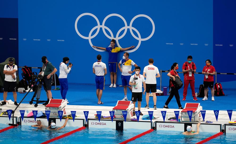 Спортсмены во время тренировки по плаванию. Фото: AP Photo/Martin Meissner
