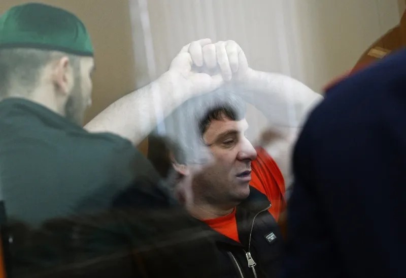 Темирлан Эскерханов в «аквариуме» суда. Фото: РИА Новости