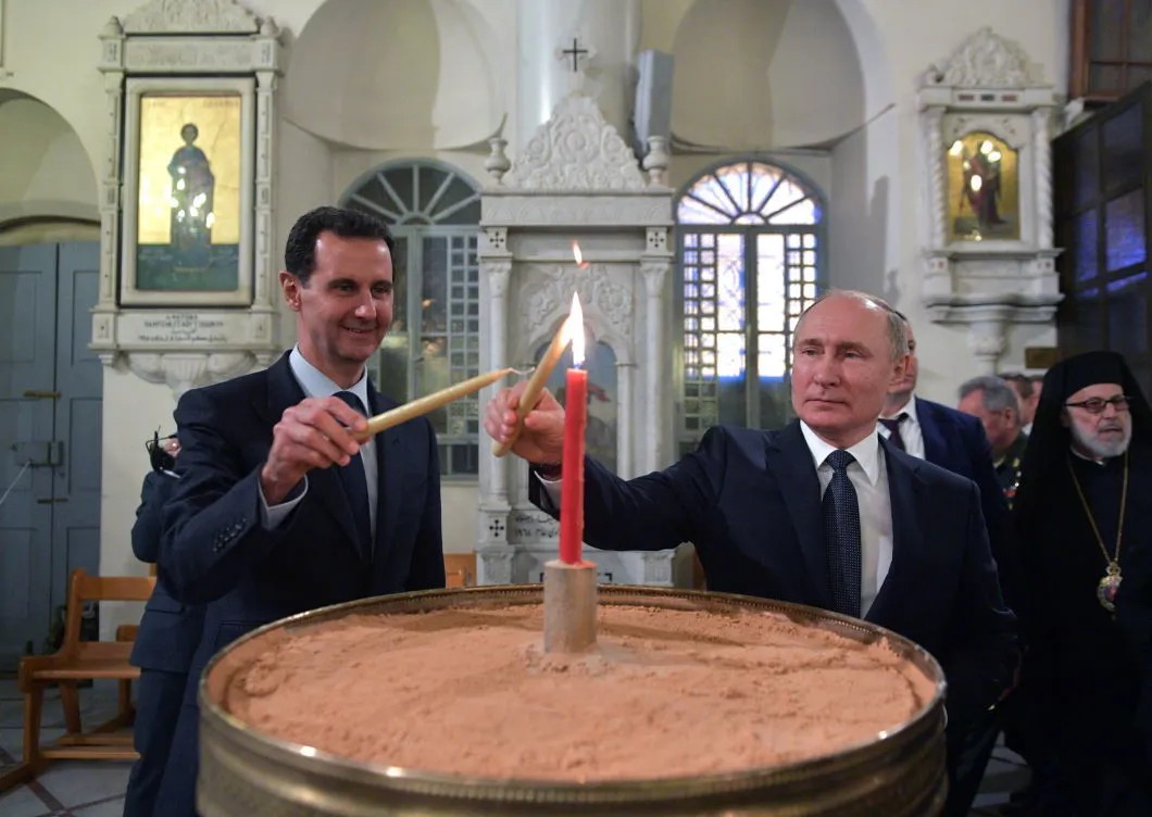7 января президент Сирии Башар Асад и Владимир Путин зажгли свечи в православном храме в Дамаске. Фото: РИА Новости